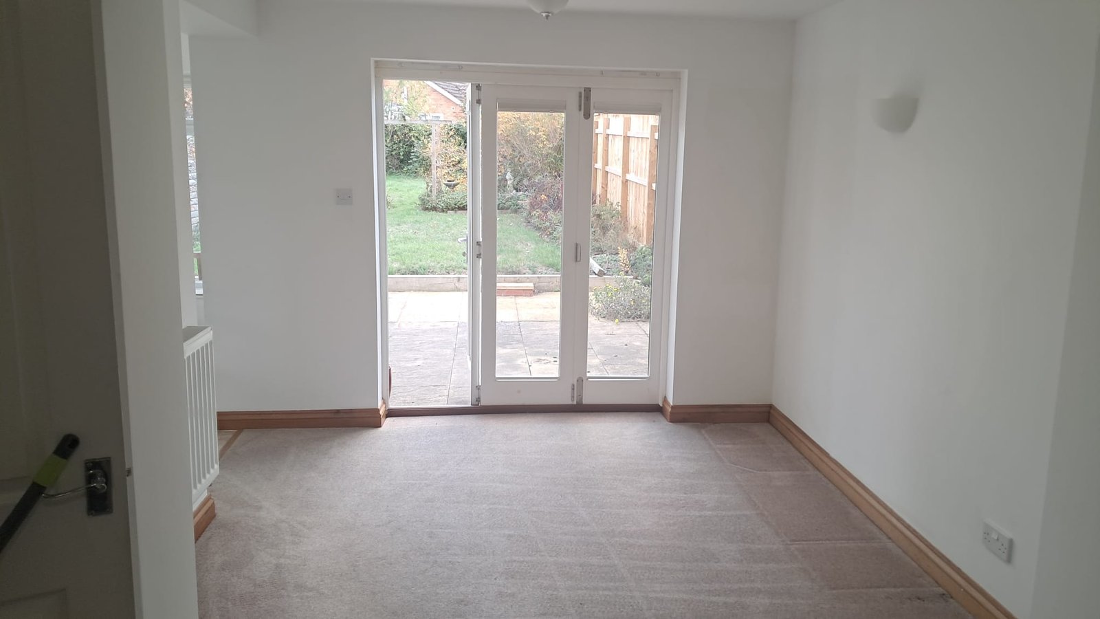 Room with patio doors following the bungalow deep clean
